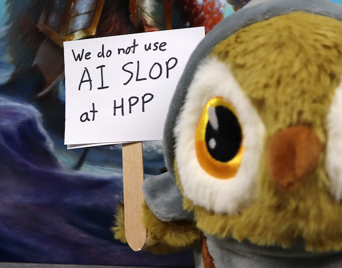 A plush owl holds up a sign that says "We do not use AI SLOP" at HPP"
